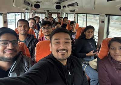 The team taking a selfie on the bus en route to the firm offsite
